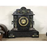 A large Art Deco mantel clock with marble accents