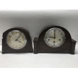 A collection of four mantel clocks.