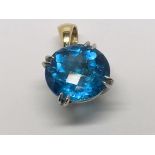 A conforming blue Topaz pendent set in 14ct gold.