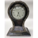 An Edwardian silver plated mantel clock in balloon