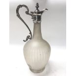 A white metal Victorian claret jug.