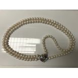 A dress jewellery pearl necklace.