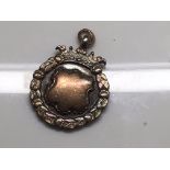 A small Edwardian silver pendant