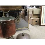 A copper cooking pot with a copper lid and gas input and a brass fire screen.