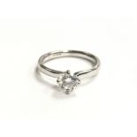 A ladies small 18ct white gold ring set with a singular 0.5ct diamond, ring size K, total weight