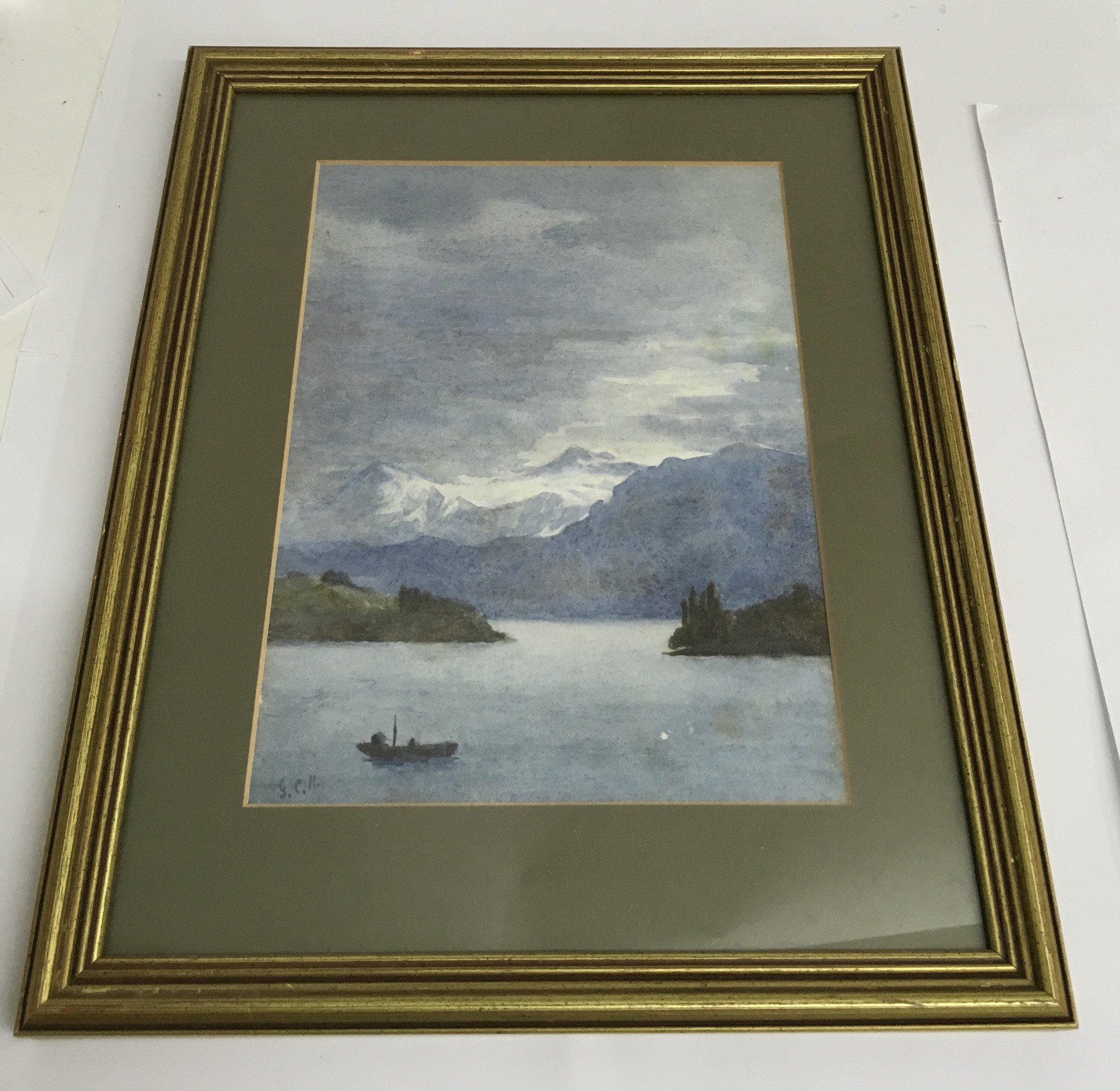 An original watercolour of a tranquil lake scene, initialled G.C.H, a map of Leigh and 19th
