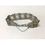 A sterling silver gate bracelet. Weight approx 21.32g