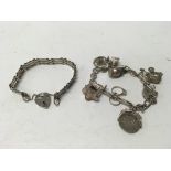 A silver charm bracelet together with a silver gat