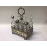 A Victorian silver cruet stand with 8 bottles, one