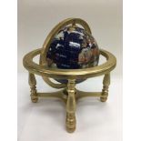 A gemstone globe, approx height 24cm.