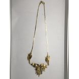 An 18ct tri-colour gold folate necklace.Approx 21c