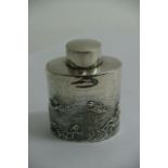 A Silver oval tea caddy decorated with cherubs, Ch