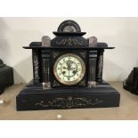 An Art Deco mantel clock decorated with marble.