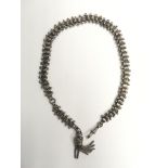 An ornate Victorian silver watch chain with tassel