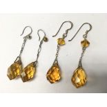 Two pairs of silver and citrine coloured earrings.