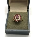 A 9ct gold cluster ring set with rubies and diamon