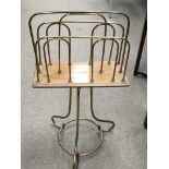 A Mahogany and brass revolving magazine rack. With