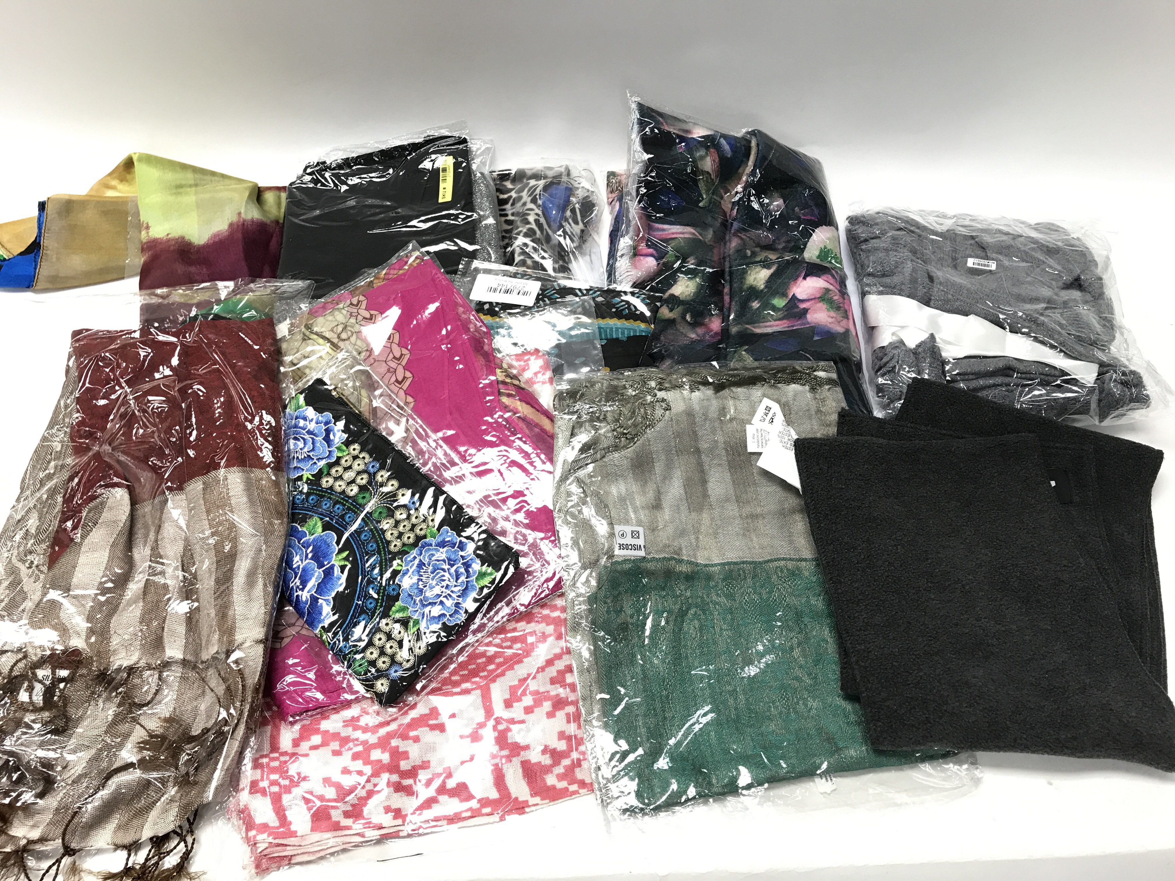 A collection of unopened pashminas, boxed Strada w