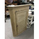 An antique pine corner cupboard, approx 95cm x 125