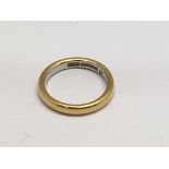 A 22ct gold and platinum wedding band.Approx 4.2g