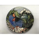 A limited edition Moorcroft dish depicting exotic