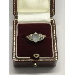 An Art Deco style gold and diamond ring set with c