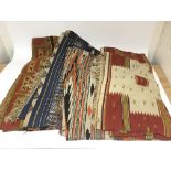 Four prayer rugs with varied colourful patterns.