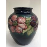 A large Moorcroft Ovid shape Peony pattern vase. B