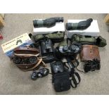 A collection of binoculars including two Hawke End