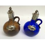 A pair of 19th century coloured glass wine bottles