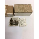 A small collection of cigarette cards views of int