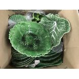 A box of green glazed plates and comports