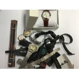 A box containing various watches including Pulsar