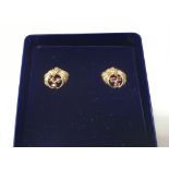 A pair of 9ct gold and ruby earrings. Weight appro