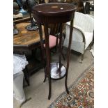 A two tier Edwardian inlaid mahogany plant stand,