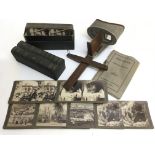 An early 20th century stereoscope with a set of Je