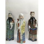 Three large Chinese figures of wise men painted in