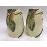 A pair of Clarice Cliff vases with naturalistic de