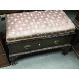 A mahogany ottoman type stool with an upholstered