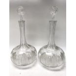 A pair of cut glass decanters.