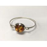 Amber and 925 silver bangle. Weight approx 11.71g