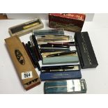 A collection of various vintage fountain pens some