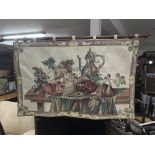 A Tapestry depicting a still life scene of fruit,