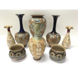 A collection of Doulton items including a pair of Doulton Slater vases.