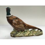 A Beswick figure of a pheasant.