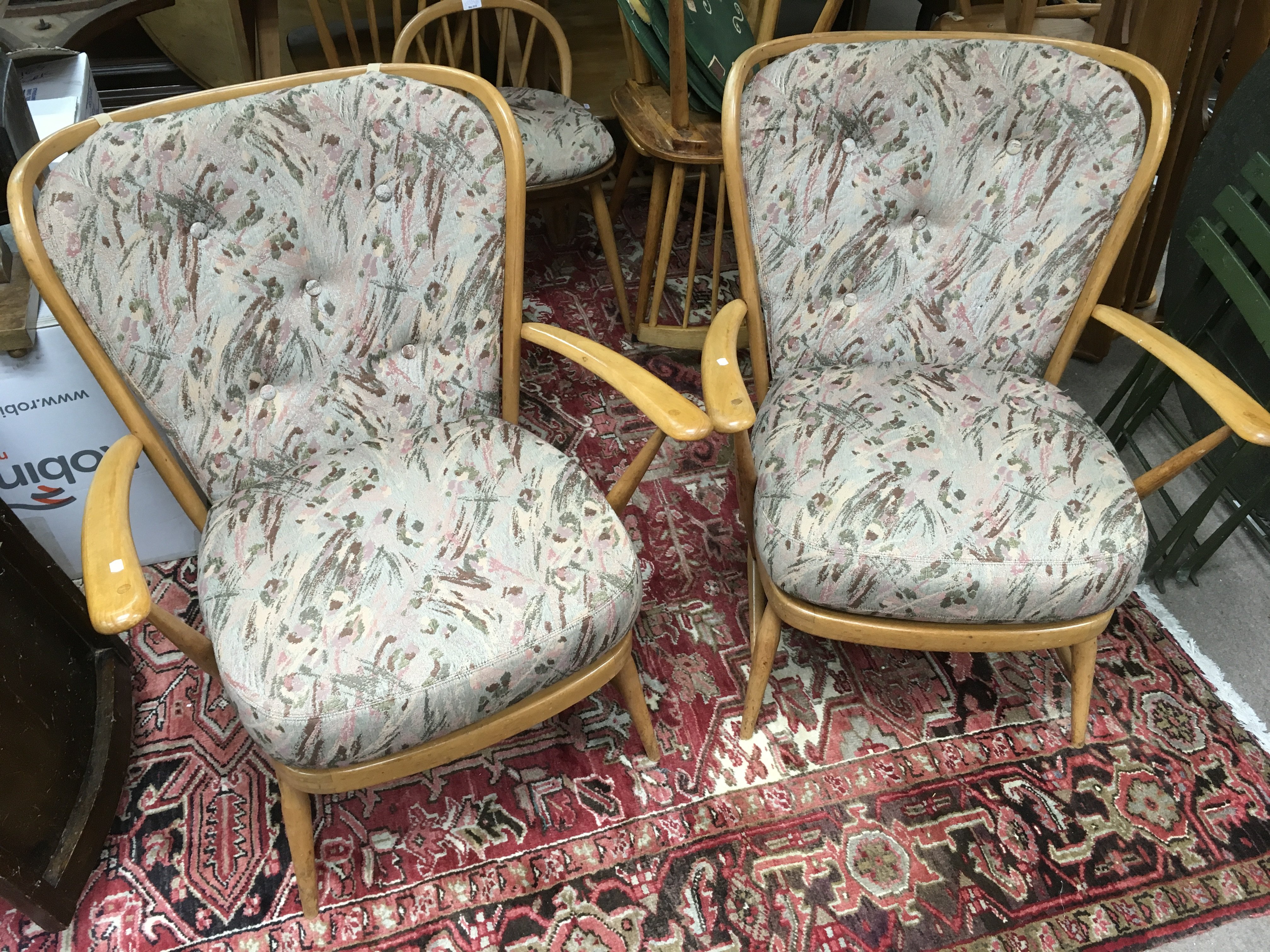 A pair of Ercol lightwood armchairs