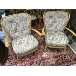 A pair of Ercol lightwood armchairs