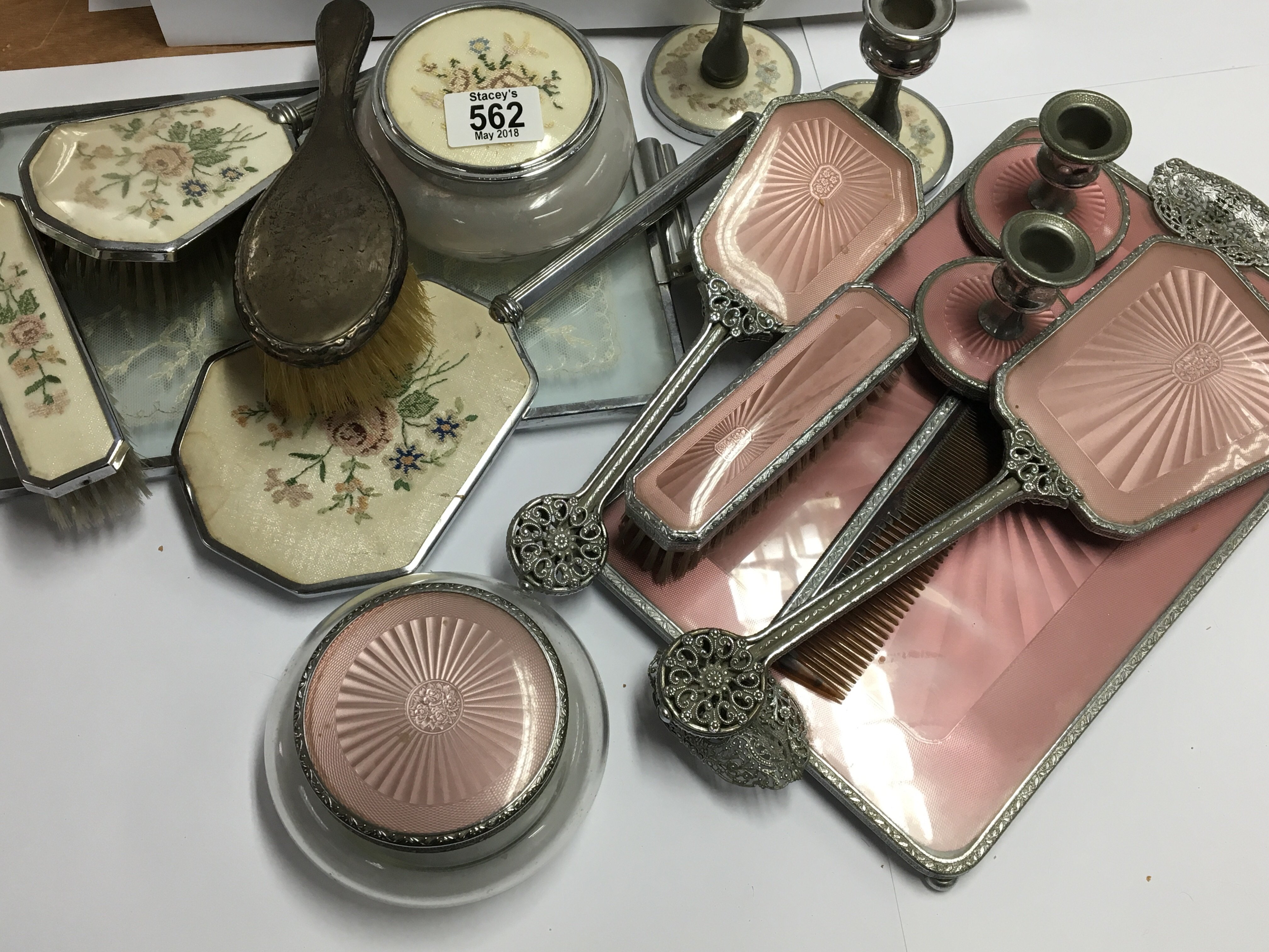 Two Ladies dressing table sets and a silver brush.
