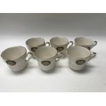 A collection of six Women's Institute cup and sauc