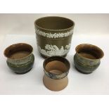 A Wedgwood style jardiniere and three Doulton planters including a pair